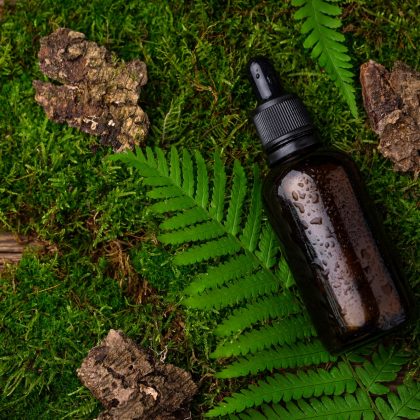 Natural cosmetic concept with glass bottle
